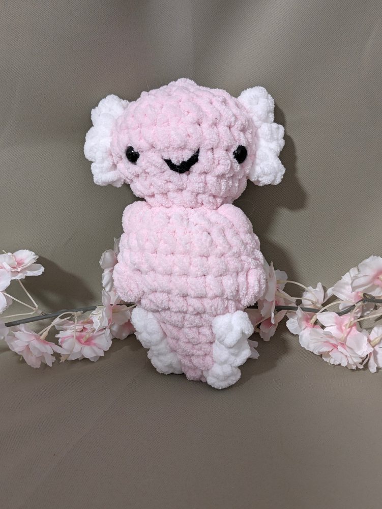 Pink chunky crochet axolotl plushie with white gills